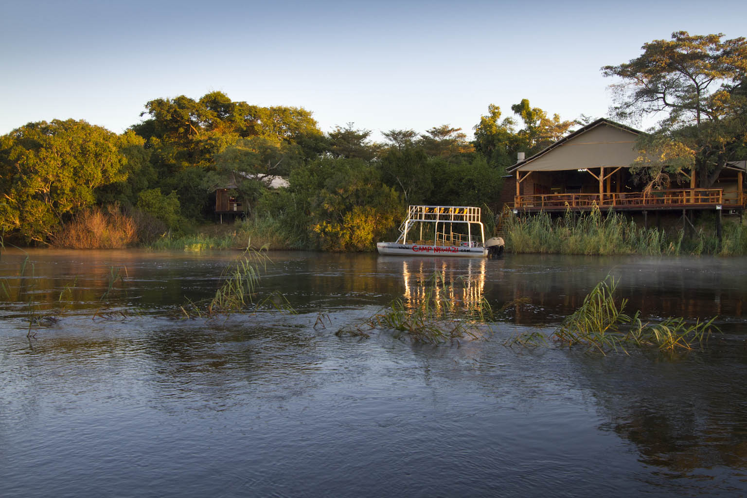 This wonderful camp is nestled on the banks of the mighty Zambezi river, about 20 minutes drive from Livingstone and about 25 minutes from one of the natural wonders of the world, the Victoria Falls!